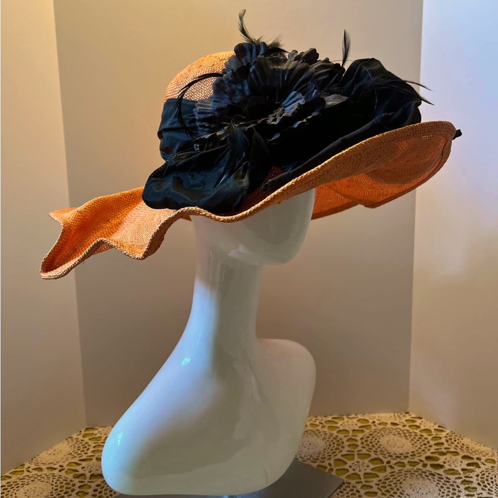 Elegant Orange and Black Hat with Wide Brim and Dramatic Decoration